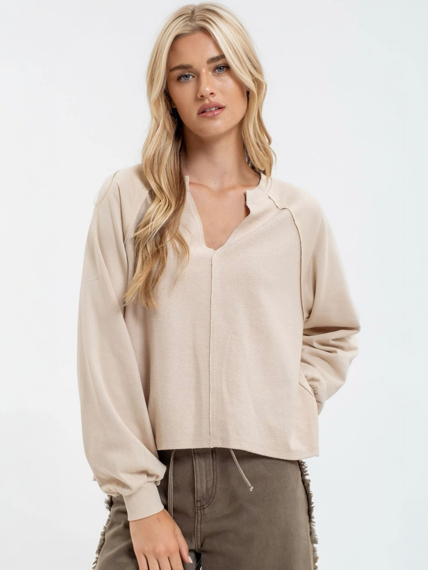 	•	Blu Pepper exposed seam relaxed long sleeve knit top in khaki
	•	Women’s khaki long sleeve knit top with split neckline
	•	Relaxed fit exposed seam knit top front view