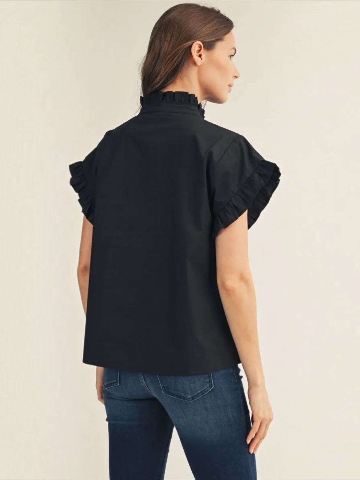 Back view of Jodifl black ruffle collar button-down cotton top